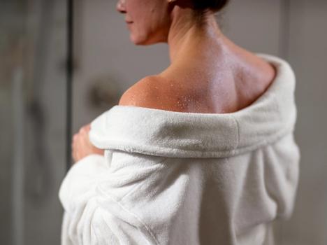 Pearl Resort Bathrobe on woman in bathroom