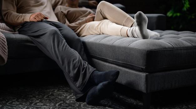 Couple wearing cozy loungewear from the Essential Collection