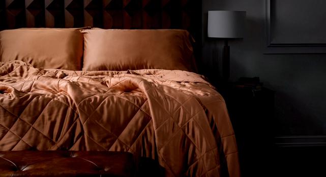 Blanket designed to drape naturally over deep mattress