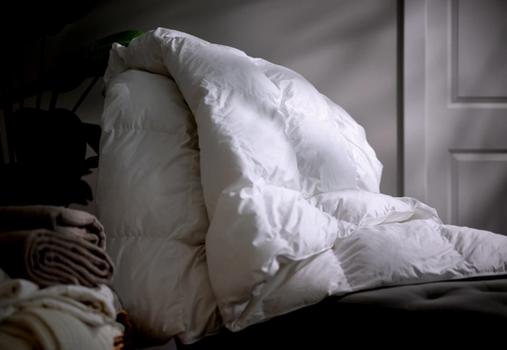 Fluffy comforter sitting on a chair