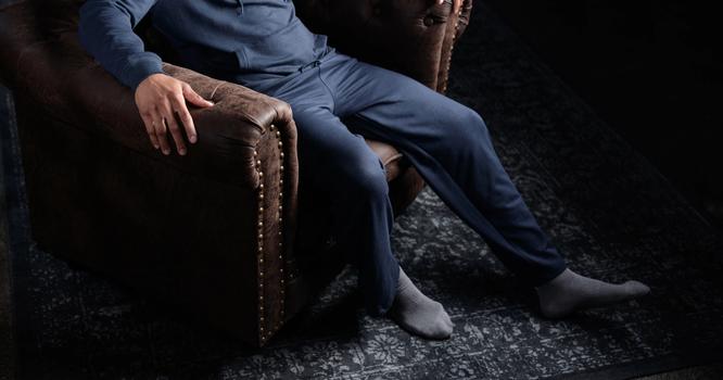 Man wearing the cozy Essential Relaxed Pant & Hoodie in storm