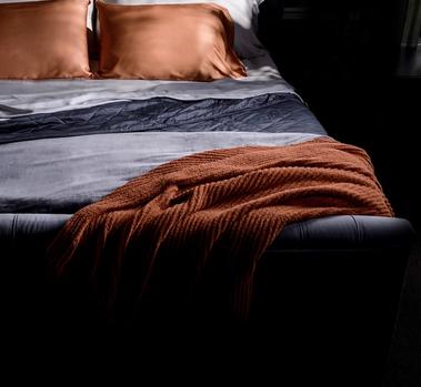 Clay Ultra Plush Throw on bed