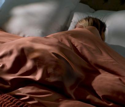 Sleeping under the cooling bamboo duvet covet in terracotta