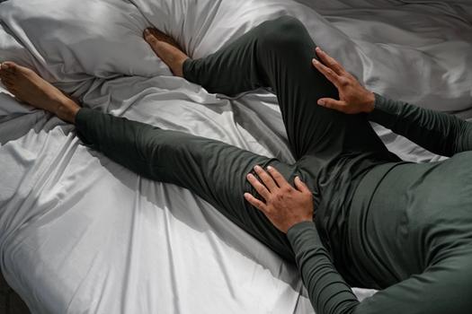 Man staying cool with Modal Pajamas in evergreen