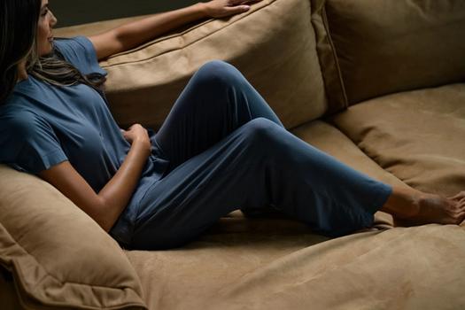 Woman staying cool in Modal Pajamas in dusk