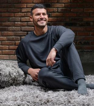Man wearing the cozy Essential Crew in charcoal