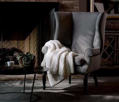 Ivory Ultra Plush Throw on a chair
