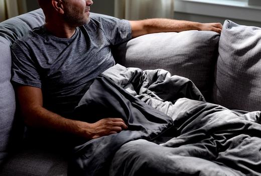 Cuddling under the cooling weighted blanket in grey