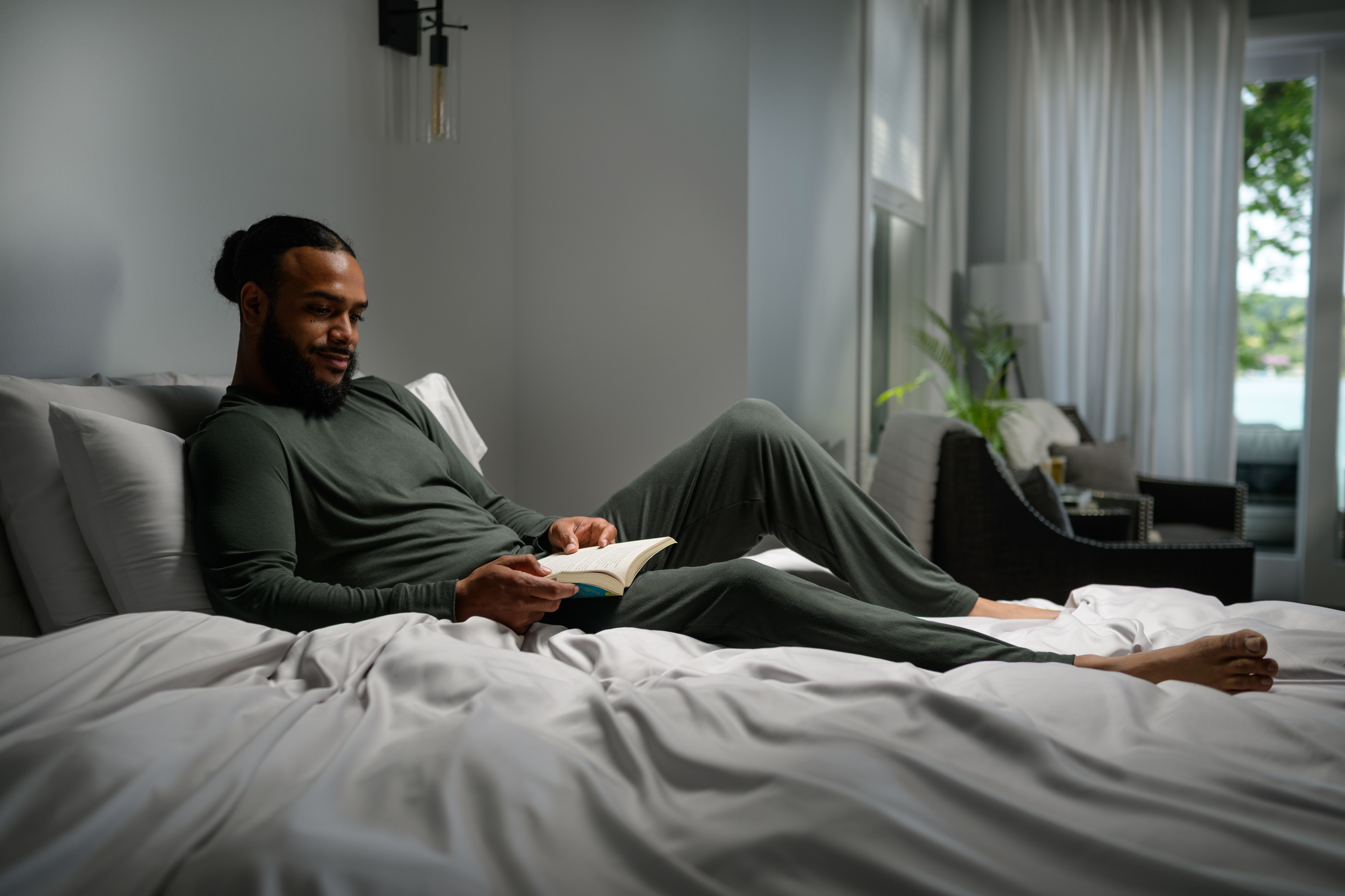 Man staying cool with Modal Pajamas in evergreen