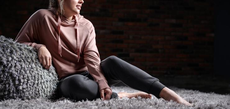 Women wearing the luxuriously soft Essential Hoodie in petal & Jogger in charcoal
