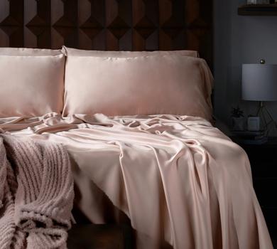 Luxury Sheets and Ultra Plush throw on a bed
