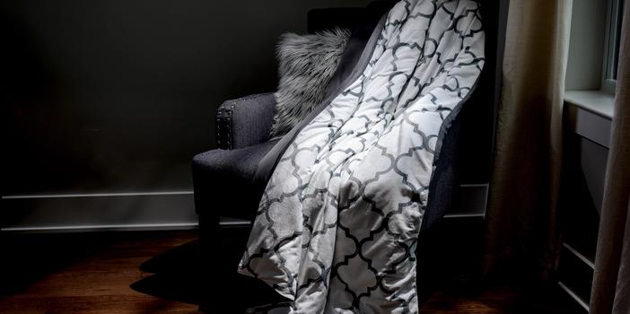 Lattice weighted blanket on accent chair