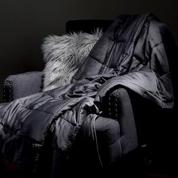 Grey weighted blanket on accent chair