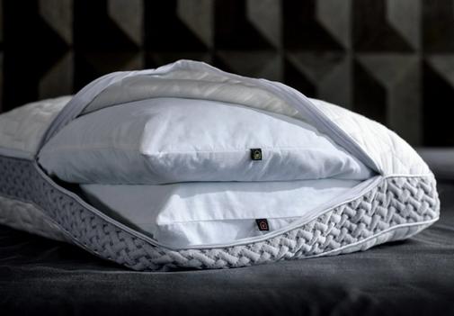 LAYR Pillow unzipped to expose inserts on bed