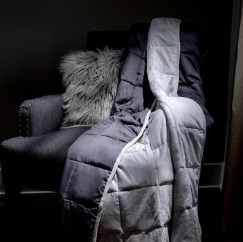 Light Grey weighted blanket on accent chair