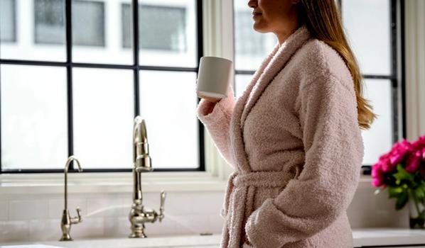 Woman wearing the cozy Ultra Plush Robe in blush
