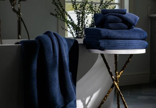 Harbor Plush Performance Towels next to a bath tub
