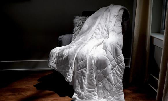 White Lightweight Blanket sitting on a chair as decor