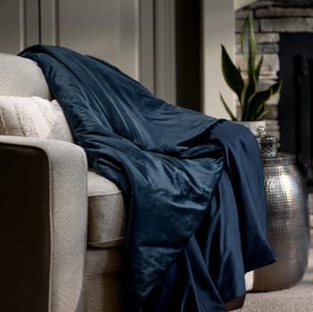 Navy weighted blanket on accent chair
