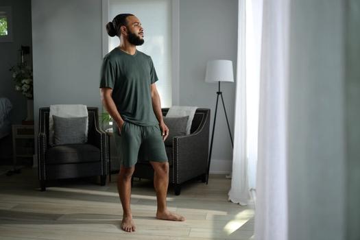 Man staying cool with Modal Pajamas in evergreen