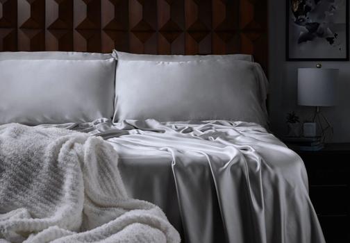 Luxury Sheets and Ultra Plush throw on a bed