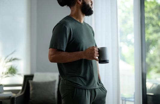 Man staying cool with Modal Pajamas in evergreen