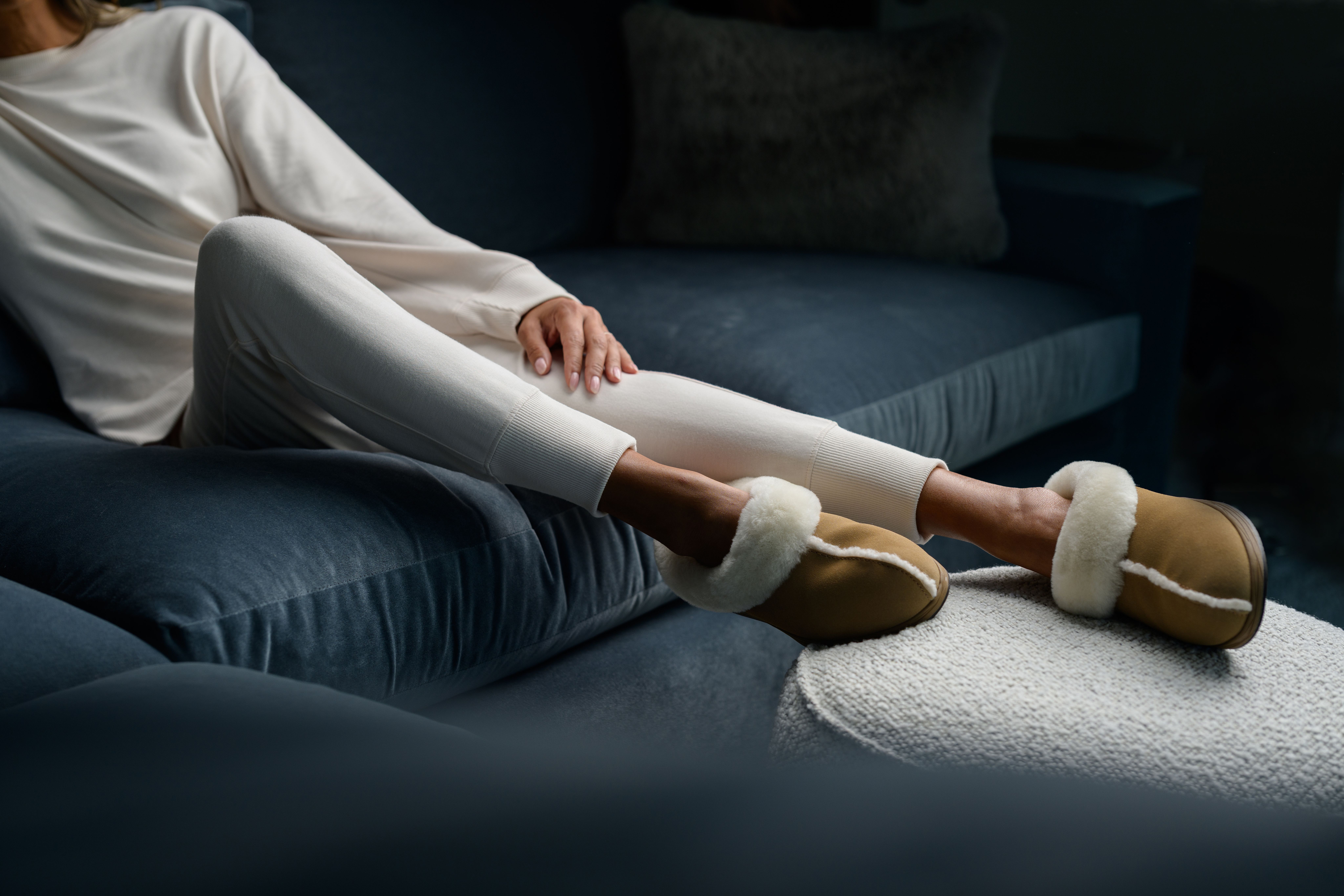 Woman wearing cozy loungewear in the color almond