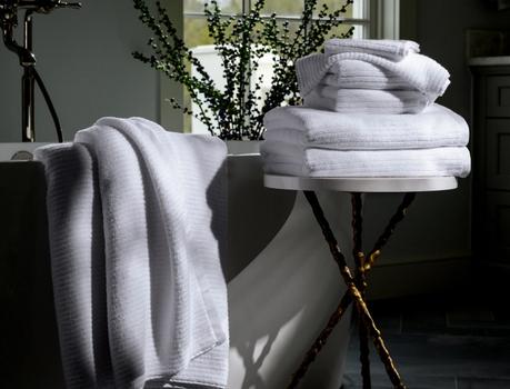 Sail Plush Performance Towels next to a bath tub