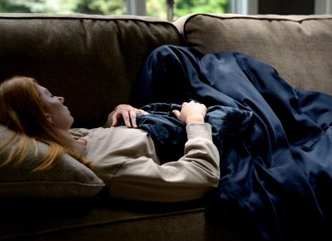Cuddling under the cooling weighted blanket in navy