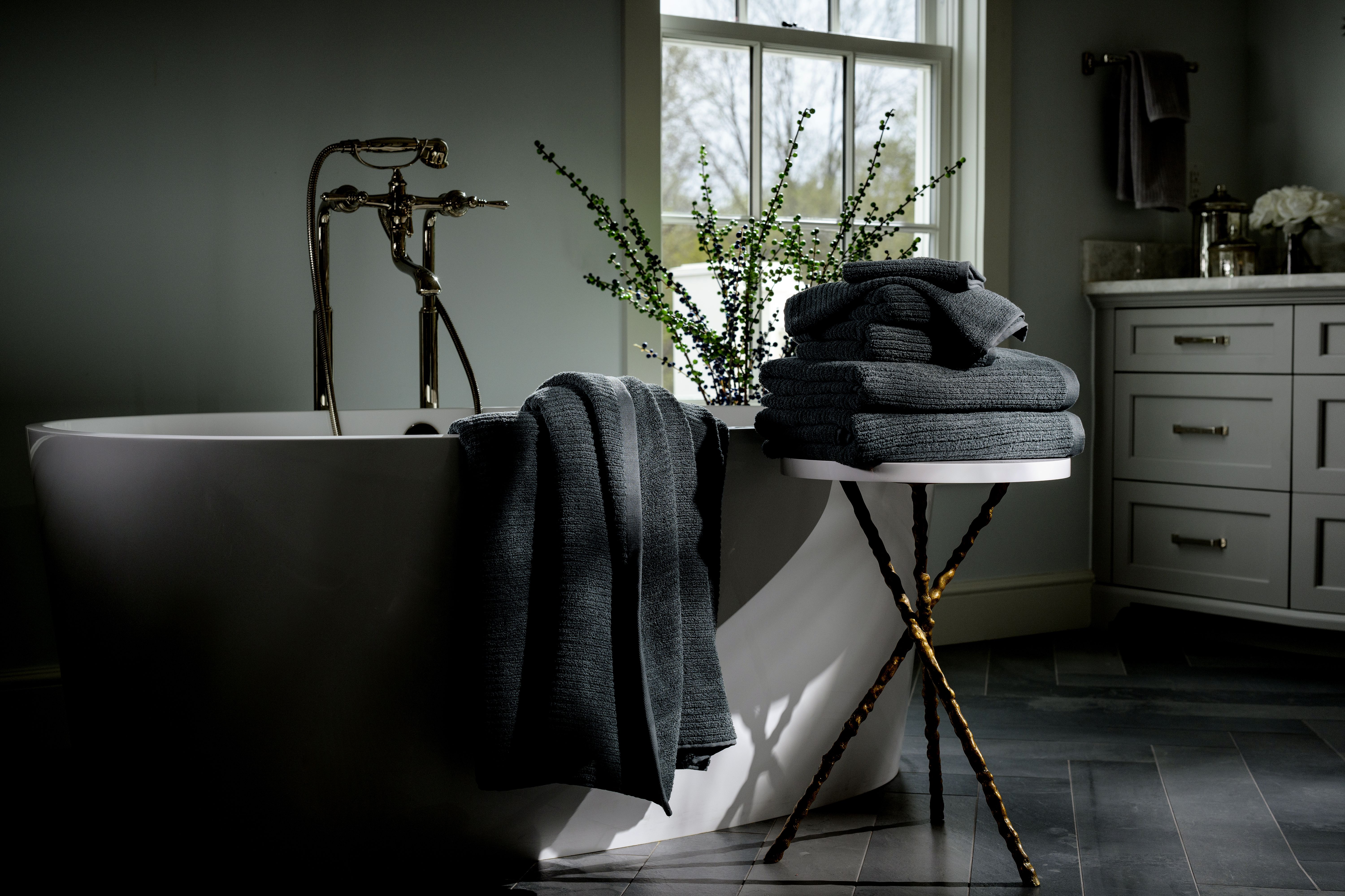 Fossil Plush Performance Towels next to a bath tub