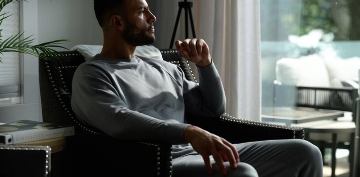 Man wearing the cozy Essential Crew in smoke