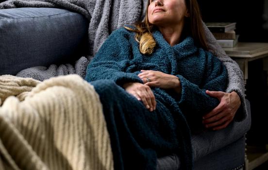 Woman cuddle with a man, both wearing the Ultra Plush Robe