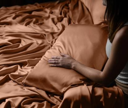 Under the cooling Luxury Bamboo Sheets in terracotta