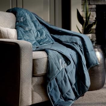 Ocean weighted blanket on accent chair
