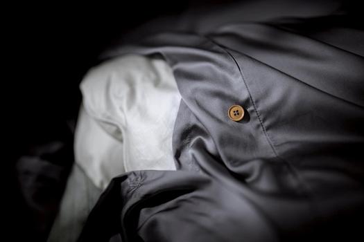 Close up of a bamboo duvet cover with extra ties in the color charcoal