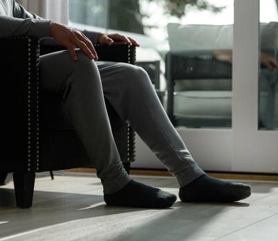 Man wearing the cozy Essential Jogger in smoke