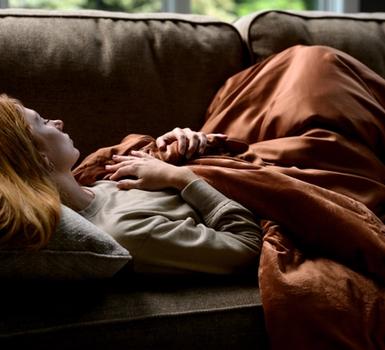 Cuddling under the cooling weighted blanket in clay