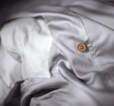 Close up of a bamboo duvet cover with extra ties in the color stone