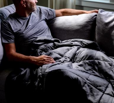 Cuddling under the cooling weighted blanket in grey