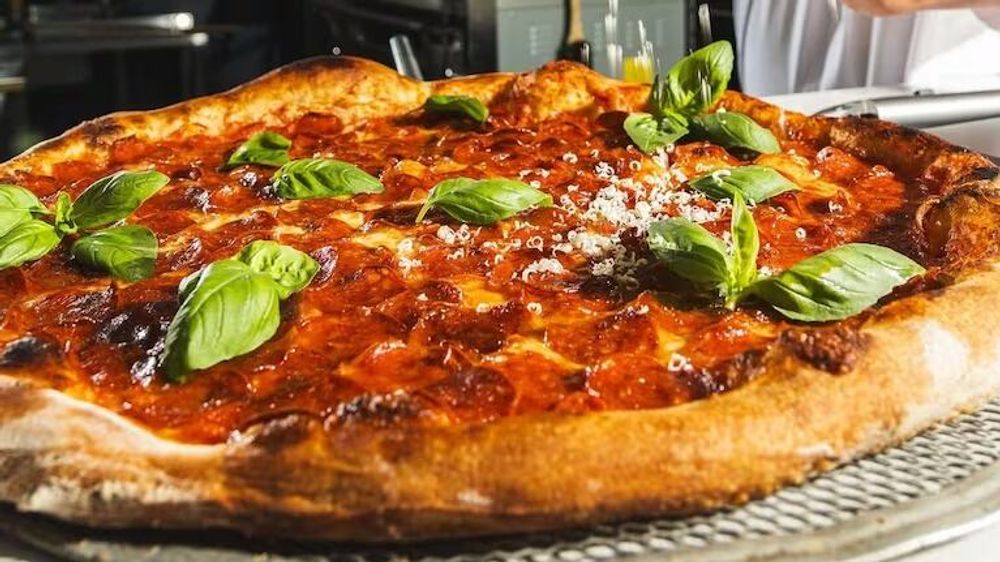 Pizzería porteña, un éxito global con su propuesta minimalista
