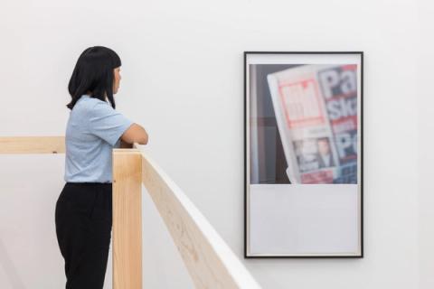 Woman looking at artwork on the wall