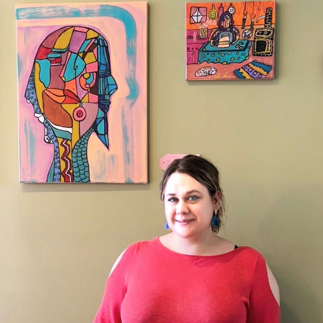 Contemporary artist at her solo exhibition featuring striking works in both realism and cubism styles.