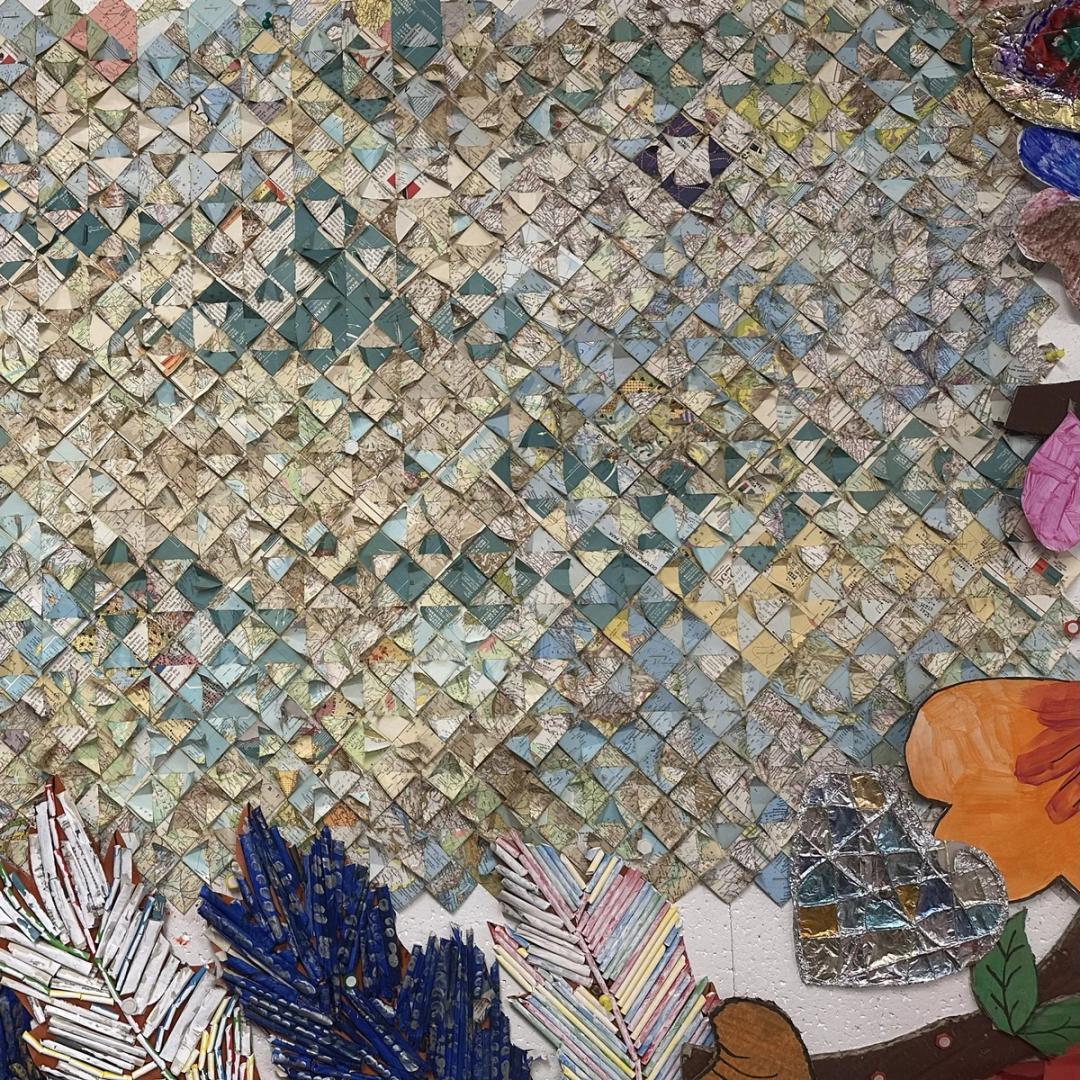 This artwork was a collaboration with an artist called Catalina. It is a gorgeous quilted masterpiece made from small pieces of a map, which have intricately been woven together by our wonderful service users.