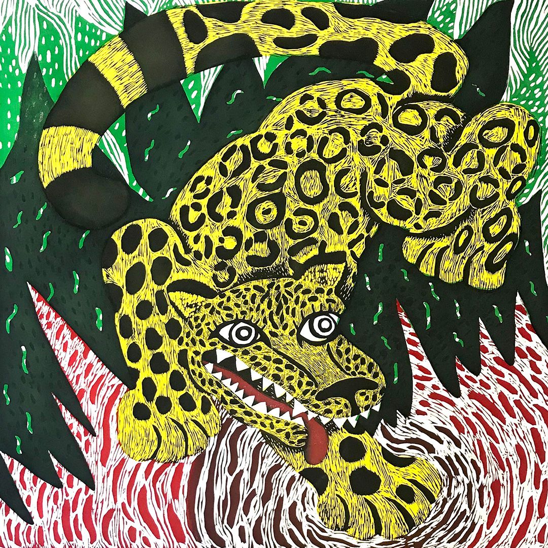 Bold graphic print of a snarling yellow and black spotted leopard lunging forward, against swirling red and green patterns.