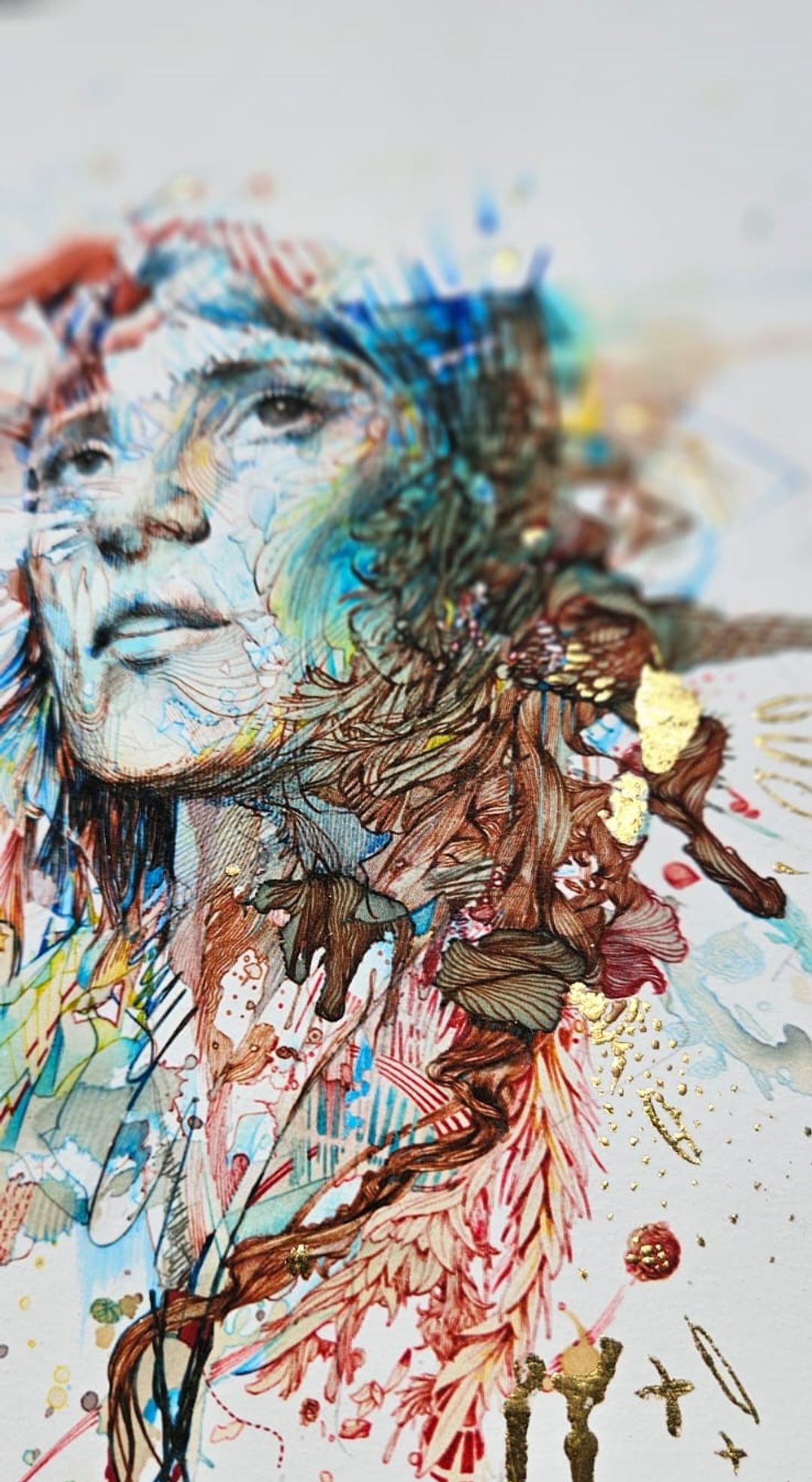 Intricate ink and watercolour artwork of a woman's face dissolving into flowing botanical forms in teal, red and gold.