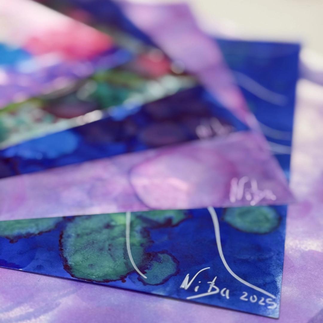A glimpse of alcohol ink paintings, with a blend of blue, lilac and green colours