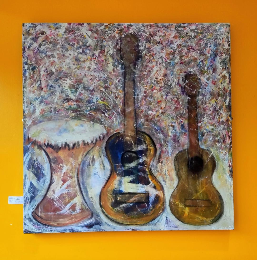 Textured painting of two acoustic guitars and a djembe drum against a speckled multicolour background, on an orange wall.