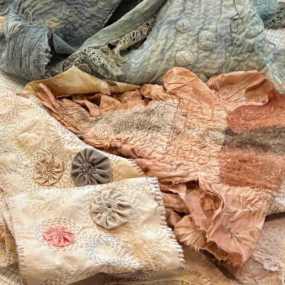 Various stitched textile items inspired by seaweed and sea life. Richly textured and dyed with the soft colours that come from natural dyes, including indigo