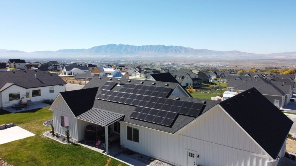 Aerial view of a solar home in a valley neighborhood