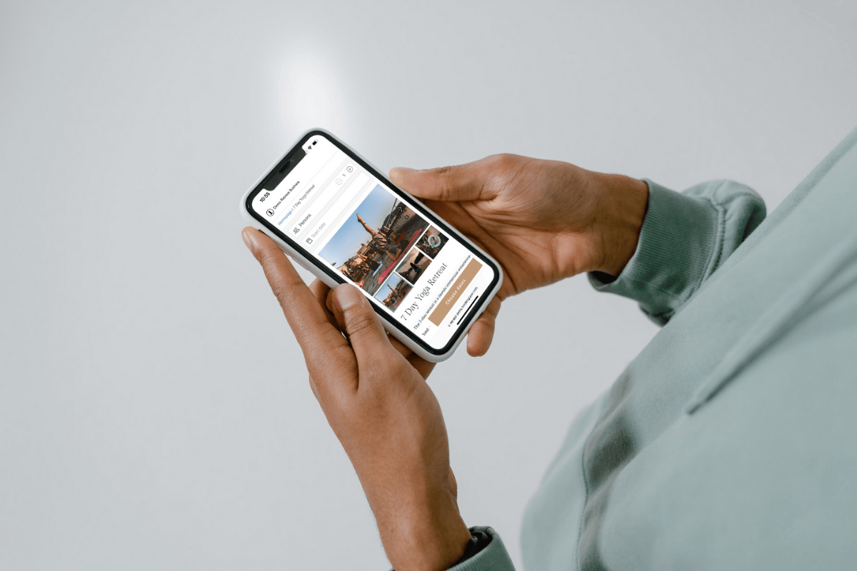A woman booking a retreat on an iPhone.